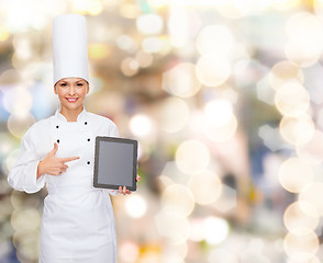 Image showing smiling female chef with tablet pc blank screen