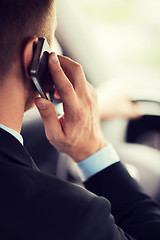 Image showing man using phone while driving the car