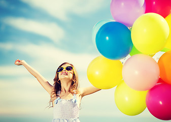 Image showing happy girl with colorful balloons