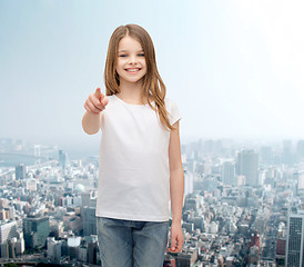 Image showing little girl in blank white t-shirt pointing at you