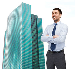 Image showing handsome businessman with crossed arms