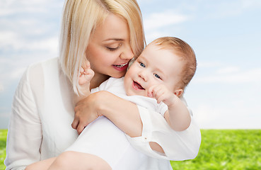 Image showing happy mother with smiling baby