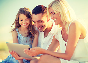 Image showing happy family with tablet pc taking picture