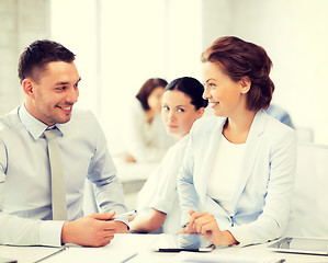 Image showing usiness colleagues talking in office