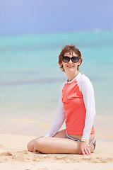 Image showing woman in rashguard at the beach