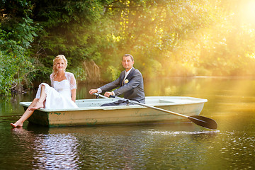 Image showing Young just married bride and groom on boat