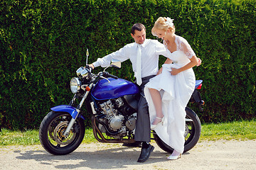 Image showing beautiful young wedding couple on motorcycle