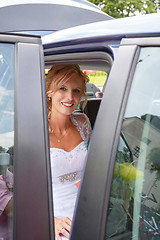 Image showing attractive caucasian bride sitting in car