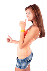 Image showing Attractive girl with freckles shows thumbs up