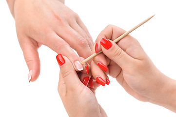 Image showing manicure applying - cleaning the cuticles 