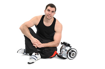 Image showing young man posing with dumbbell