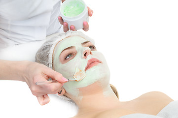 Image showing beauty salon, facial mask applying