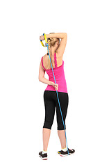 Image showing Female triceps extention exercise using rubber resistance band