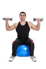 Image showing Dumbbell Shoulder Press on stability ball