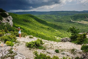 Image showing Young woman against the storm