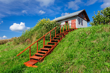 Image showing Village house at hill, with stairs