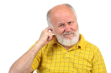 Image showing bald senior man picking his ear