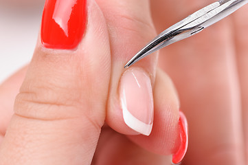 Image showing manicure applying - cutting the cuticle 