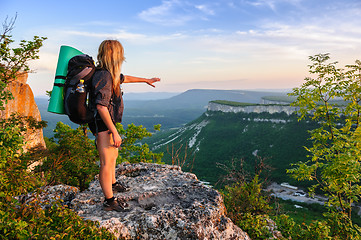 Image showing Hiking woman in rays of sunset