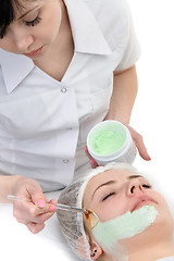 Image showing beauty salon, facial mask applying