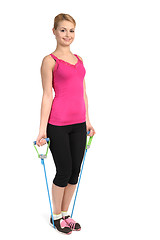 Image showing Female biceps exercise using rubber resistance band