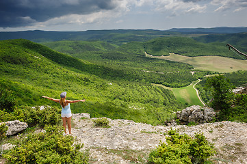 Image showing Young woman against the storm