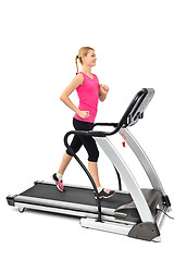 Image showing young woman doing exercises on treadmill