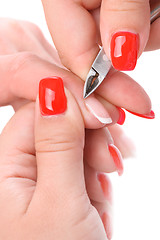 Image showing manicure applying - cutting the cuticle 