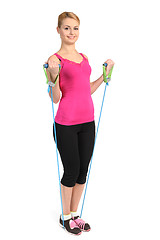 Image showing Female biceps exercise using rubber resistance band