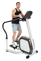 Image showing one man doing step machine exercise