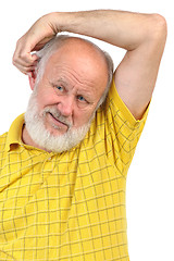 Image showing balding senior man skratching his other ear