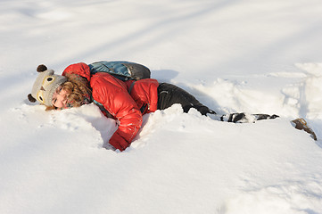 Image showing young girl playing in snow