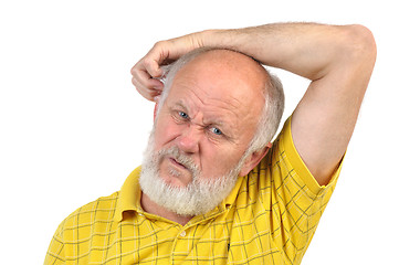 Image showing balding senior man skratching his other ear