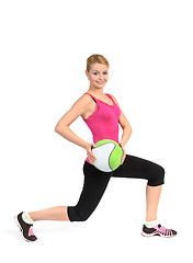 Image showing Girl doing lunges exercise with medicine ball 