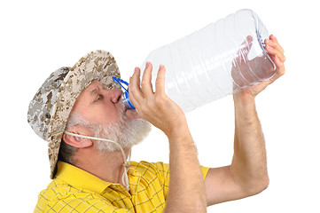 Image showing senior man looking into empty bottle