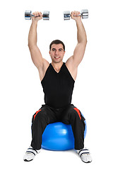 Image showing Dumbbell Shoulder Press on stability ball