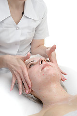 Image showing facial massage with scrub mask 