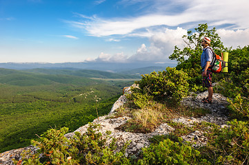 Image showing Hiking man in rays of sunset