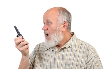 Image showing senior bald man talking using walkie-talkie