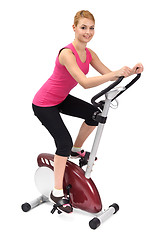 Image showing young woman doing indoor biking exercise