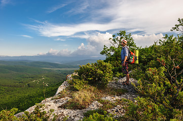 Image showing Hiking man in rays of sunset