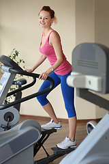 Image showing young girl doing step machine workout