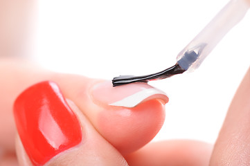 Image showing manicure, applying clear enamel