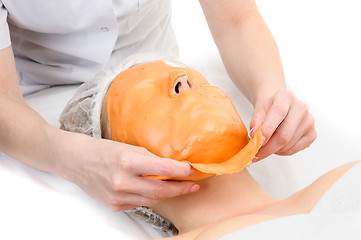 Image showing Removing alginate peel-off facial mask