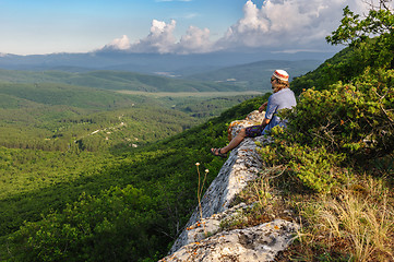 Image showing Hiking man in rays of sunset