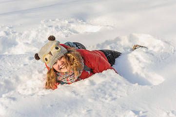 Image showing young girl playing in snow