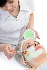 Image showing beauty salon, facial mask applying