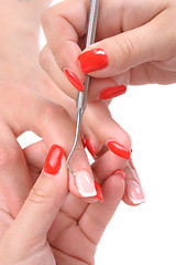 Image showing manicure applying - cleaning the cuticles 