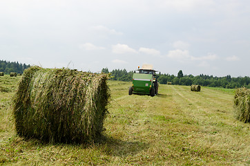 Image showing Straw bales agricultural machine gather hay 