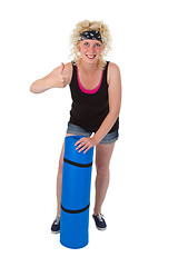 Image showing Young woman with gym  mat